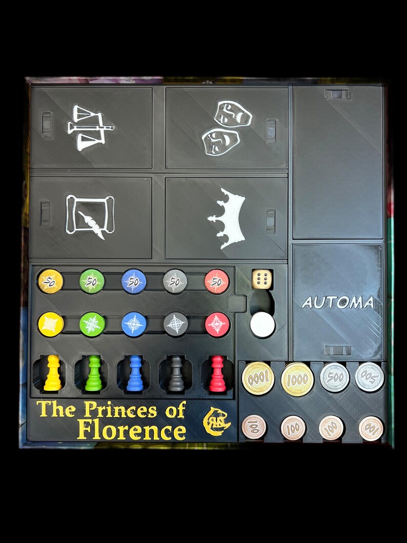 Op de afbeelding: Een zwarte spelorganizer met vakken voor spelstukken, dobbelstenen en geld. De organizer heeft de tekst "The Princes of Florence" op de voorkant.