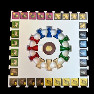 May include: A white game board with a central circular area containing a wooden spinning wheel with colored pegs. The board has a grid of squares with various colored tiles depicting different resources. The tiles are labeled with numbers.