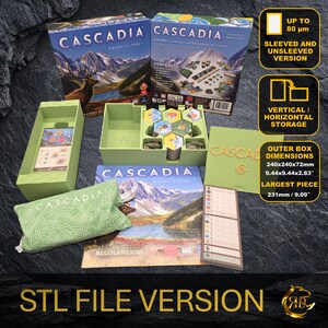 May include: An organized board game set with the title "Cascadia" on the box. The set includes a green storage tray, game pieces, and a green bag. The box dimensions are 9.44x9.44x2.83 inches. The largest piece is 9.09 inches.