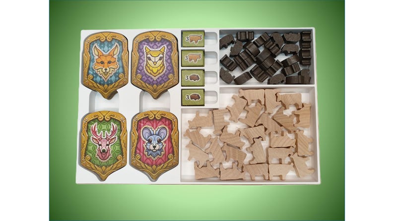 May include: A white wooden box with four colorful animal shields and two compartments filled with wooden animal and house shaped pieces.