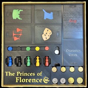 May include: The Princes of Florence board game insert with compartments for game pieces, character cards, and coins. The insert is black with gold lettering and includes a bag for storing game pieces.