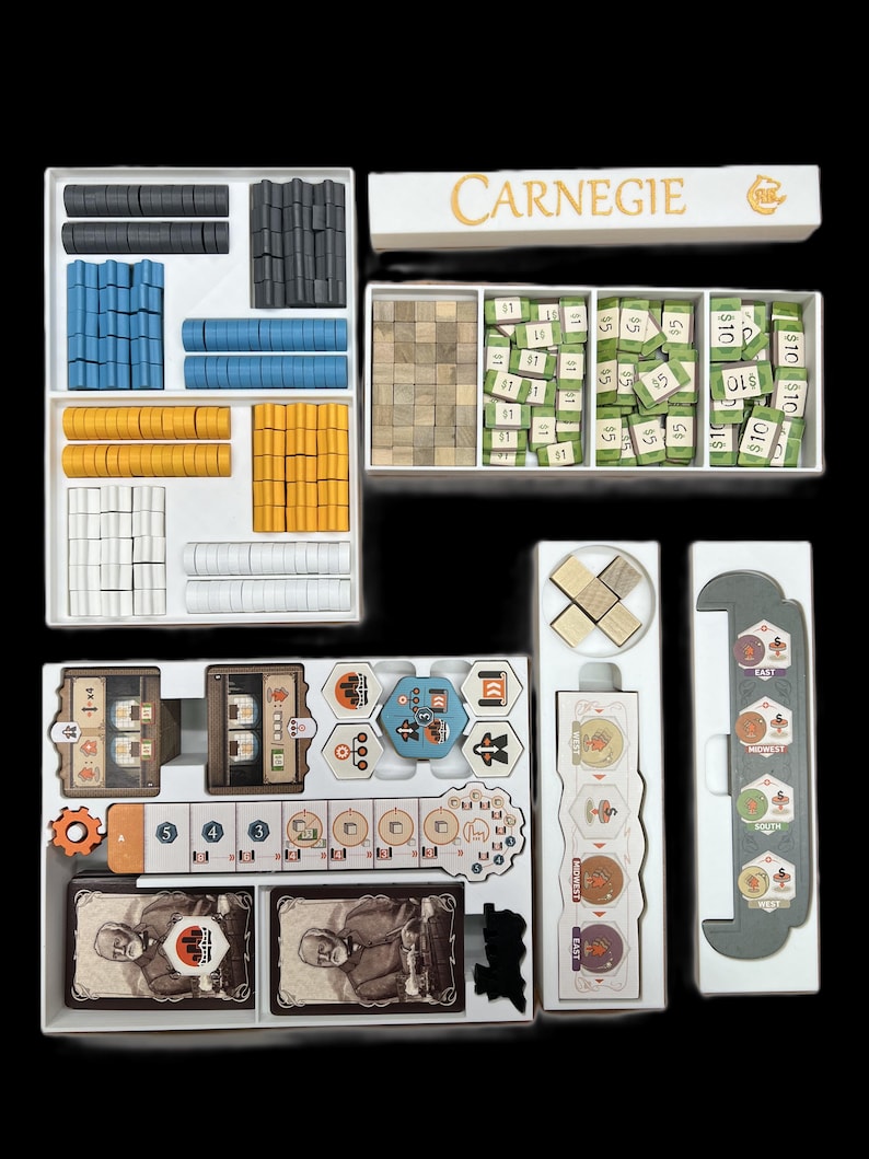 May include: A white organizer box with compartments for storing game pieces and components. The box has a label that reads "CARNEGIE". The box contains various game pieces, including wooden cubes, plastic tokens, and cardboard cards.