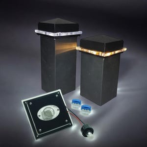 May include: Two black square post cap lights with white LED lights around the top edge. A smaller square light with a clear lens is also shown. Two blue wire connectors are included.