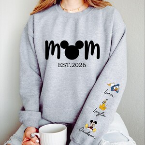 Comfort Colors® Personalized Disney Mickey and Friends Mama Sweatshirt, Disney Custom Mom,With Kids Name On Sleeve, Mother's Day Gift