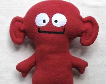 Plush monster, soft alien fantasy creature in brick red fleece, 11.5 inches