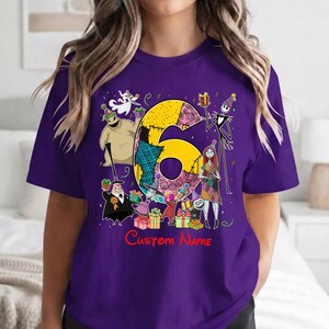 May include: A purple t-shirt featuring a large yellow number six surrounded by characters from The Nightmare Before Christmas, including Jack Skellington, Sally, and Oogie Boogie, with colorful gift boxes and the red text Custom Name.