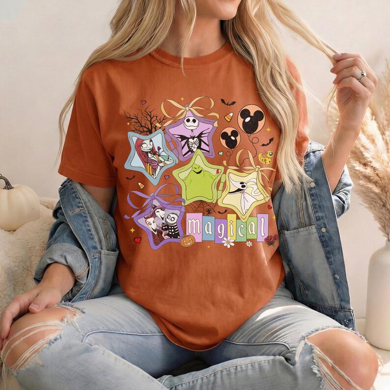 May include: A white ceramic mug with a black handle and the text "But First, Coffee" in a bold, black font. The mug is set against a blurred background, suggesting a cosy setting.