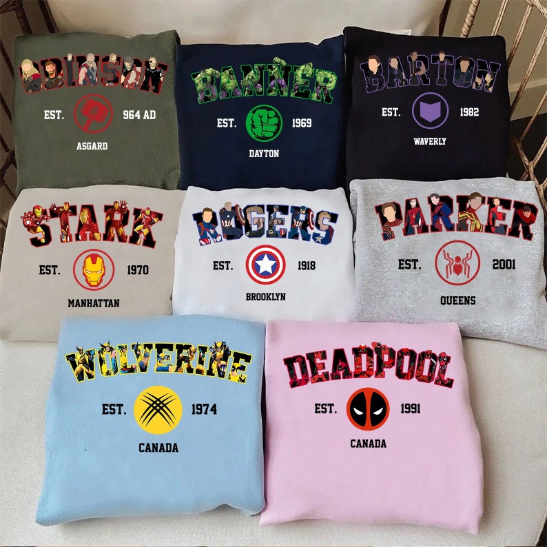 May include: A selection of crewneck sweatshirts in different colours, each with a character name in a college-style font. The sweatshirts feature character-related imagery, establishment dates, and locations. Colours include green, navy, black, beige, white, light blue, and pink.