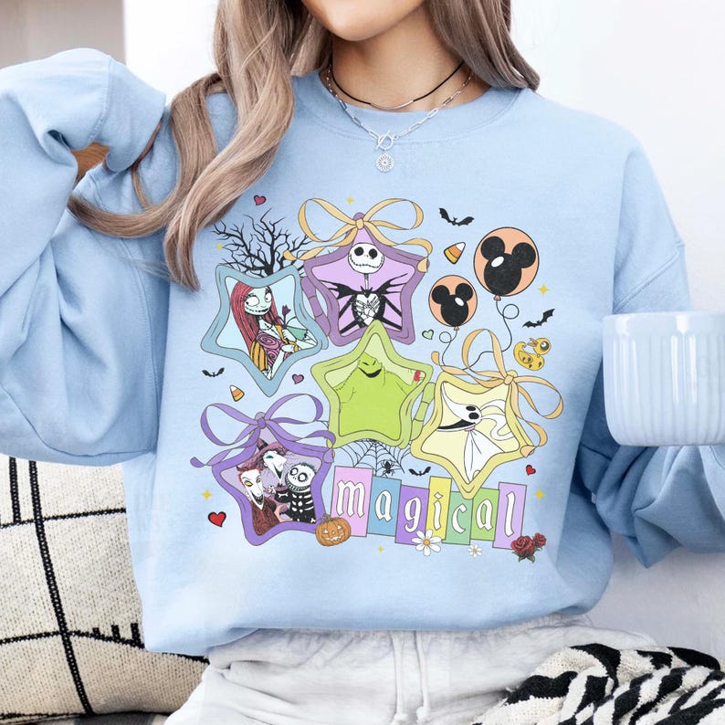 May include: A white ceramic mug with a black handle and the text "But First, Coffee" in a bold, black font. The mug is set against a blurred background, suggesting a cosy setting.