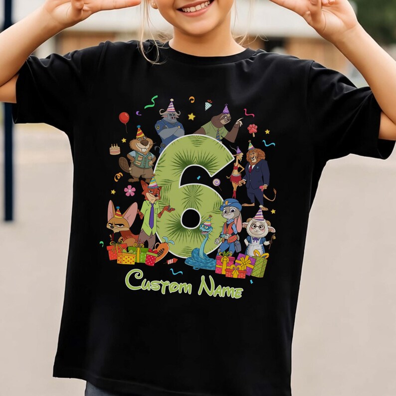 May include: A black short-sleeve t-shirt featuring a large green number six surrounded by various cartoon animal characters wearing party hats. The design includes colorful gift boxes, confetti, and the text Custom Name at the bottom.