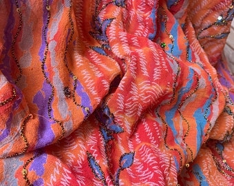 3. Recycled silk, remnant sari piece, beaded silk fabric, orange, red, purple, metallic thread embroidery.