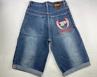 May include: A pair of blue denim shorts with a red and white Phat Farm logo on the back pocket.