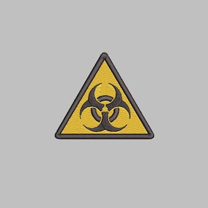 May include: Yellow triangle warning sign with a black biohazard symbol. The symbol is a stylized three-pronged shape.