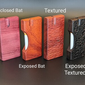 May include: Four wooden boxes with different wood grains and finishes. The boxes are labeled "Enclosed Bat", "Textured", "Exposed Bat", and "Exposed Textured".