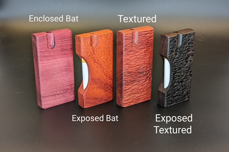 May include: Four wooden boxes with different wood grains and finishes. The boxes are labeled "Enclosed Bat", "Textured", "Exposed Bat", and "Exposed Textured".