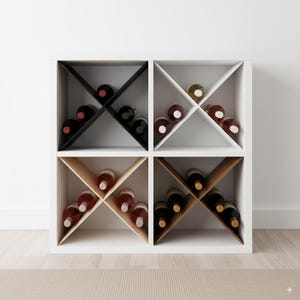 May include: A white square wine rack with four compartments, each holding wine bottles. The rack has a modern design with diagonal supports. Some compartments are black, white, and natural wood-toned.