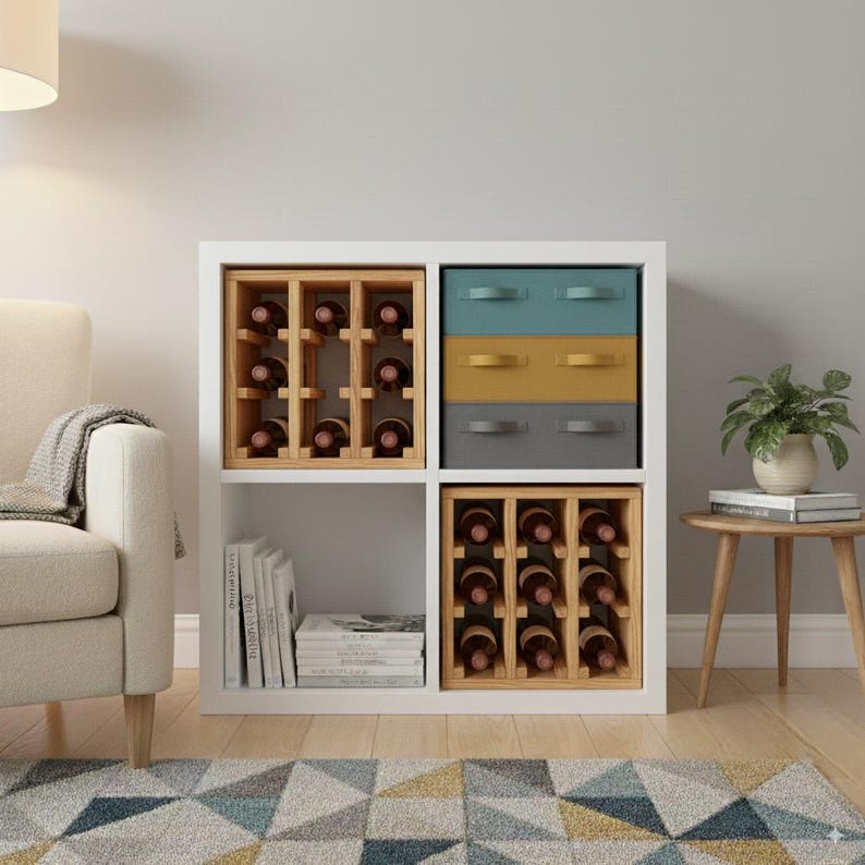 May include: A white cube storage unit with four compartments. Two compartments hold wooden wine racks with bottles. The other two compartments have drawers in teal, yellow, and gray. A small potted plant sits on a wooden side table.