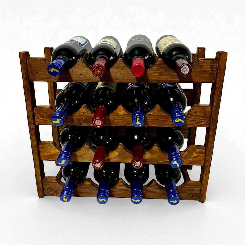 May include: A wooden wine rack with a dark stain, holding twelve bottles of red wine. The bottles are arranged in three rows of four, with alternating blue and red bottle caps. The rack has a simple, geometric design.