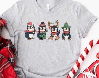 クリスマス ペンギン シャツ、かわいいペンギン クリスマス スウェットシャツ、かわいいペンギン クリスマス クルーネック、クリスマス ペンギン ラバー シャツ、ペンギン スウェットシャツ