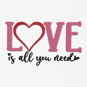 May include: Embroidered design with the word "LOVE" in pink letters and a red heart. The text "is all you need" is written in black cursive below the word "LOVE".