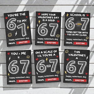 May include: Six Valentine's Day cards with a chalkboard design. Each card has a white number 67, with phrases like "You're the 6 to my 7" and "Happy Valentine's Day from Easton". The cards are on a white wood surface.