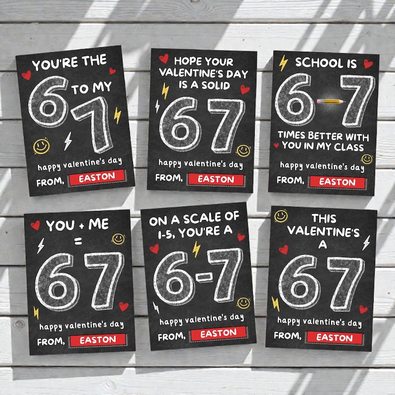 May include: Six Valentine's Day cards with a chalkboard design. Each card has a white number 67, with phrases like "You're the 6 to my 7" and "Happy Valentine's Day from Easton". The cards are on a white wood surface.