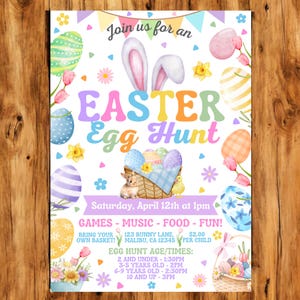 May include: A colorful invitation for an Easter Egg Hunt. The invitation features a bunny rabbit, eggs, flowers, and the text "Join us for an Easter Egg Hunt". The event is scheduled for Saturday, April 12th at 1 pm. The invitation also includes details about games, music, food, and fun. There is a note to bring your own basket and the address is 123 Bunny Lane, Malibu, CA 12345. The cost is $2.00 per child. The invitation also lists the egg hunt age and times: 2 and under - 1:30 pm, 3-5 years old - 2 pm, 6-9 years old - 2:30 pm, and 10 and up - 3 pm.