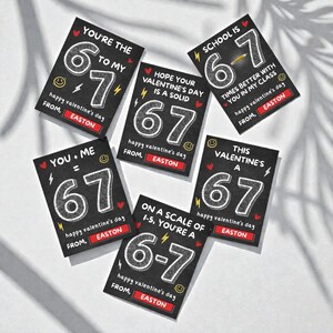 May include: A collection of Valentine's Day cards with a chalkboard design. Each card features the number 67, along with various phrases like "You're the 6 to my 7" and "Happy Valentine's Day from Easton."