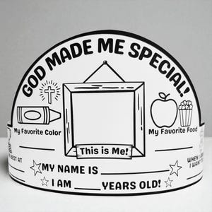 May include: A monochrome paper crown with the words "GOD MADE ME SPECIAL!" and spaces to write "My Favourite Colour," "My Favourite Food," and "This is Me!" Features a cross, crayon, apple, and popcorn illustrations.
