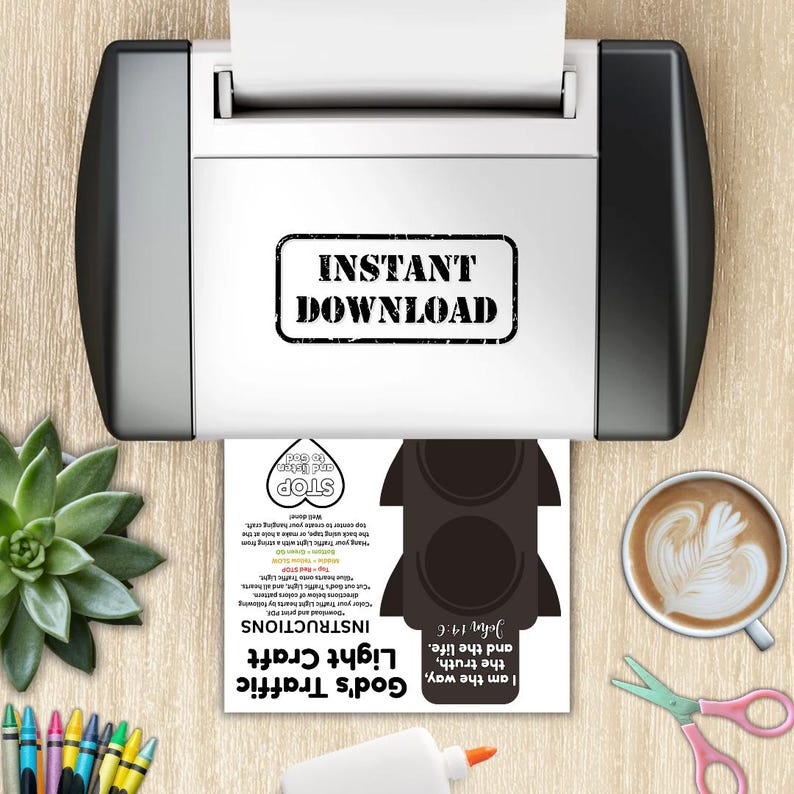 May include: A printer is shown with a printed sheet featuring a black traffic light craft design. The sheet includes the text "God's Traffic Light Craft" and instructions. A cup of coffee, scissors, and glue are also visible.