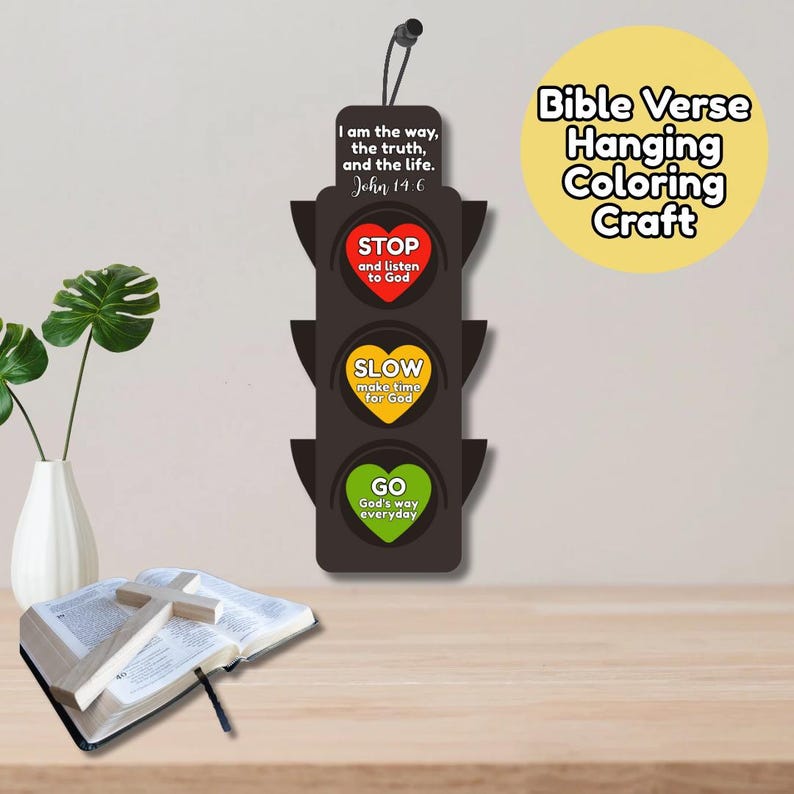 May include: A black traffic light-shaped hanging craft with the text "I am the way, the truth, and the life. John 14:6." The lights say "STOP," "SLOW," and "GO," with related text. A Bible and cross are in the foreground.