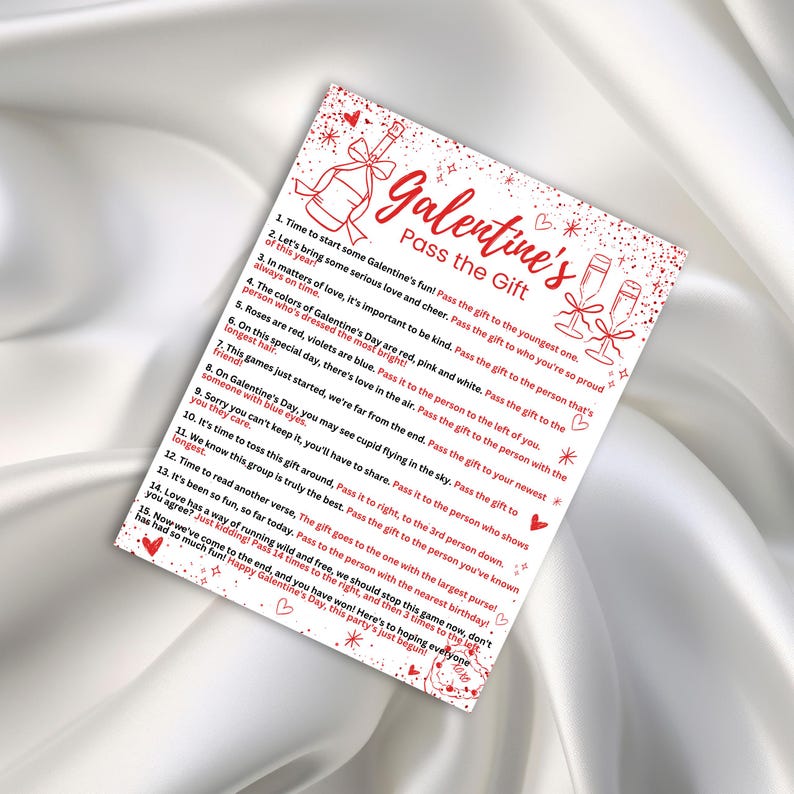 May include: A printable Galentine's Day game card with red hearts and stars. The card has instructions for a "Pass the Gift" game with 15 steps. The text reads: "Time to start some Galentine's fun! Pass the gift to the youngest one. Let's bring some serious love and cheer. Pass the gift to who you're so proud of this year!"