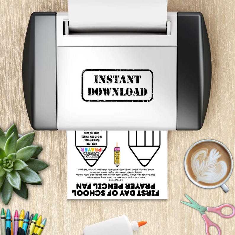 May include: A printer is shown with a printed sheet that says "Instant Download". The sheet has instructions for a "First Day of School Prayer Pencil Fan". A cup of coffee, scissors, glue, and colored pencils are also visible.