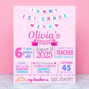 May include: A pink poster with the text "In My 1st Grade Era" and "Olivia's Version." It includes details like age, date, height (114 cm), favorite activities, and future aspirations. The teacher's name is Ms. Swift.