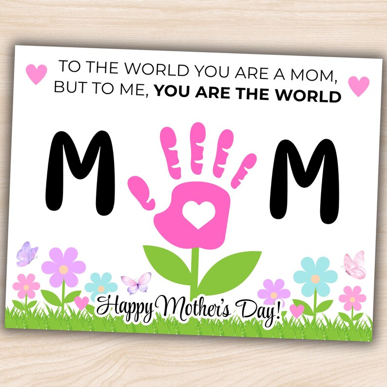 May include: A Mother's Day card with the words "TO THE WORLD YOU ARE A MOM, BUT TO ME, YOU ARE THE WORLD." The word "MOM" is spelled out with the letters "M" and a pink handprint. The card has a floral and butterfly design.