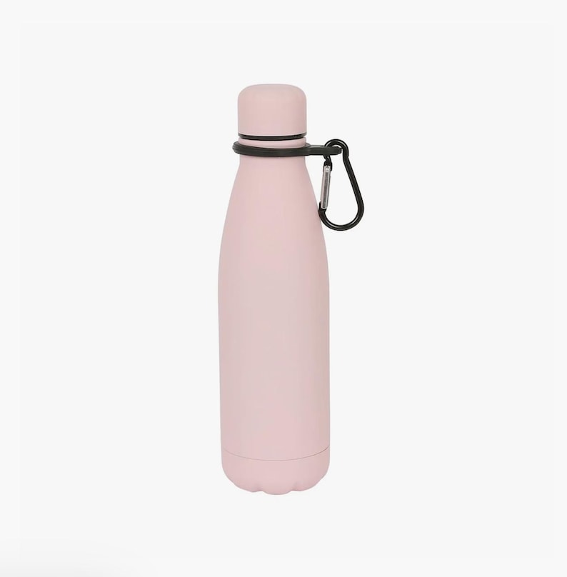 May include: A light pink water bottle with a smooth matte finish, featuring a matching screw-top lid and a black silicone ring around the neck. A black metal carabiner clip is attached to the silicone ring for easy carrying and secure attachment.