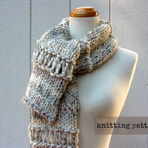 May include: A knitted scarf in a beige and white color scheme with a textured pattern. The scarf is draped over a white mannequin. The text "knitting pattern" is visible in the bottom right corner of the image.