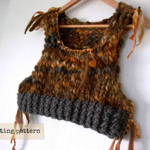May include: A brown, orange, and gray knitted vest with a textured, chunky knit. The vest has a scoop neck and is trimmed with fringe.