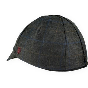 Gregario Winter Cap handmade with short brim by Red Dots Cycling. 100% Italian wool cashmere fabric in grey, blue & camel. Ear flap inside cap position. Red Dots burgundy logo embroidered on side panel.