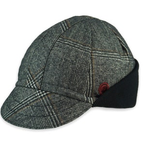 Presta Winter Cap handmade with short brim by Red Dots Cycling. 100% Glen check black/white wool plaid fabric. Black ear flap is double-layered, bamboo cotton ribbed in up position. Red Dots burgundy logo embroidered on side panel.