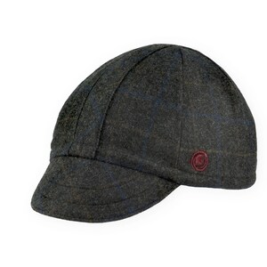 Gregario Winter Cap handmade with short brim by Red Dots Cycling. 100% Italian wool cashmere fabric in grey, blue & camel. Ear flap inside cap position. Red Dots burgundy logo embroidered on side panel.