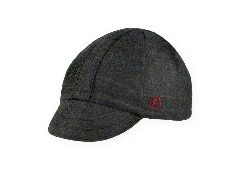 Gregario Winter Cap handmade with short brim by Red Dots Cycling. 100% Italian wool cashmere fabric in grey, blue & camel. Ear flap inside cap position. Red Dots burgundy logo embroidered on side panel.