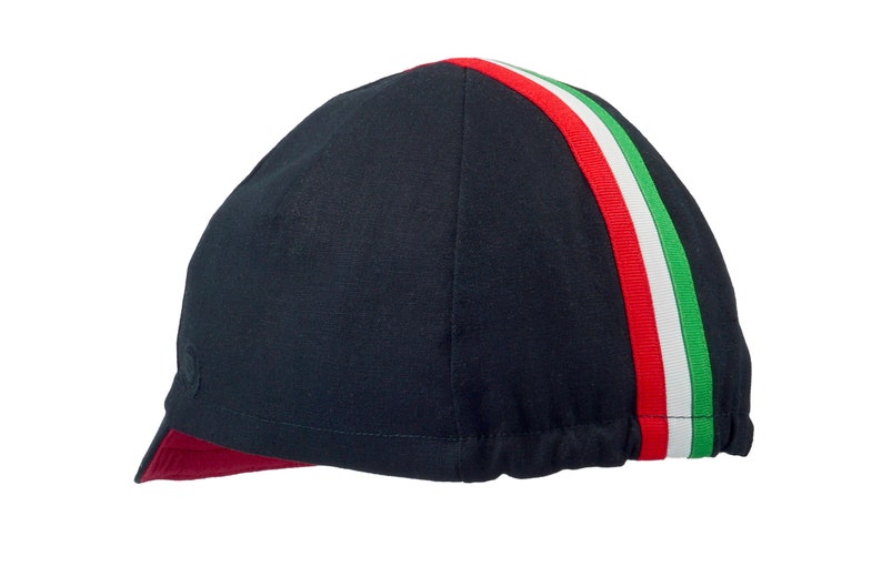 Tifosi Cycling Cap
A four-panel, Black linen/cotton hat with a red under brim. Green, white and red ribbon runs from the back of the hat to the bottom of the brim. Red Dots embroidered Black logo on the side panel.