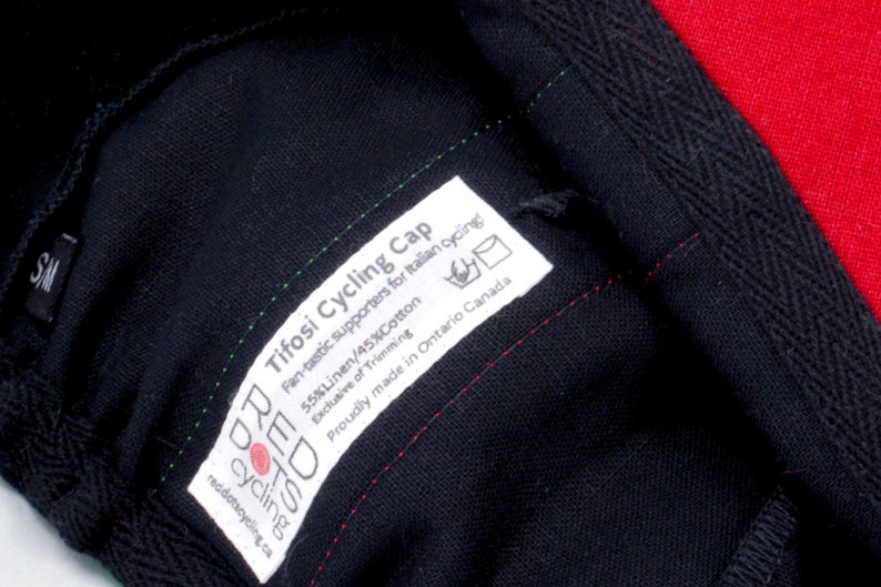 Tifosi Cycling Cap by Red Dots Cycling.
Close-up of our sewn-in label. Including; cap name, fabric content, washing care and sizing.