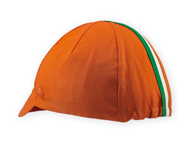 Bilbao Cycling Cap 4 panels short brim Cap handmade by Red Dots Cycling. Cap is all orange linen / cotton with red underbrim. Two ribbons: white and green to bottom of brim. Red Dots logo in orange embroidered on side panel.