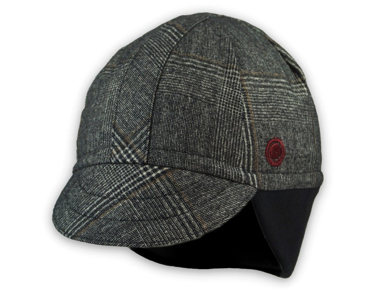 Presta Winter Cap handmade with short brim by Red Dots Cycling. 100% Glen check black/white wool plaid fabric. Black ear flap is double-layered, bamboo cotton ribbed. Red Dots burgundy logo embroidered on side panel.
