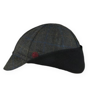 Gregario Winter Cap handmade with short brim by Red Dots Cycling. 100% Italian wool cashmere fabric. Colors: grey, blue & camel. Black ear flap is double-layered, bamboo cotton ribbed in up position. Red Dots burgundy logo embroidered on side panel.