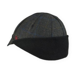 Gregario Winter Cap handmade with short brim by Red Dots Cycling. 100% Italian wool cashmere fabric. Colors: grey, blue & camel. Black ear flap is double-layered, bamboo cotton ribbed in up position. Red Dots burgundy logo embroidered on side panel.