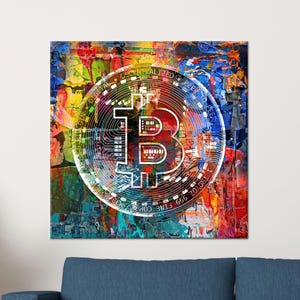 May include: A Bitcoin symbol is overlaid on a colorful abstract painting. The Bitcoin logo is white and circular, with the letters "B" and the words "Decentralized Peer to Peer" around the edge. The painting has a textured appearance with vibrant colors.