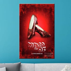 May include: A poster featuring the iconic ruby slippers from "The Wizard of Oz" against a textured red background. The shoes are embellished with sequins and have a pointed toe and a small heel. The movie title is displayed in white, stylized lettering.